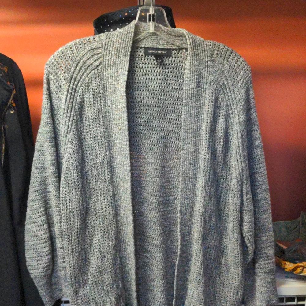 Long sweater. No buttons. Long sleeves. 100 percent cotton, but this is very war